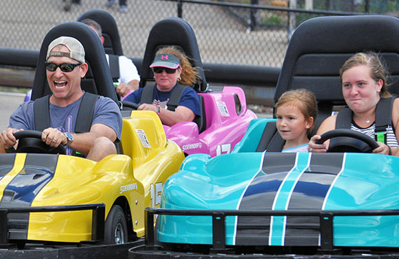 People racing GoKarts